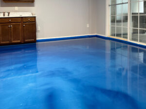 Bright blue metallic epoxy flooring used in a residential basement. Monmouth Junction, NJ. Lumiere by duraamen. 2254