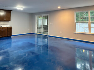 Bright blue metallic epoxy flooring used in a residential basement. Monmouth Junction, NJ. Lumiere by duraamen. 2256