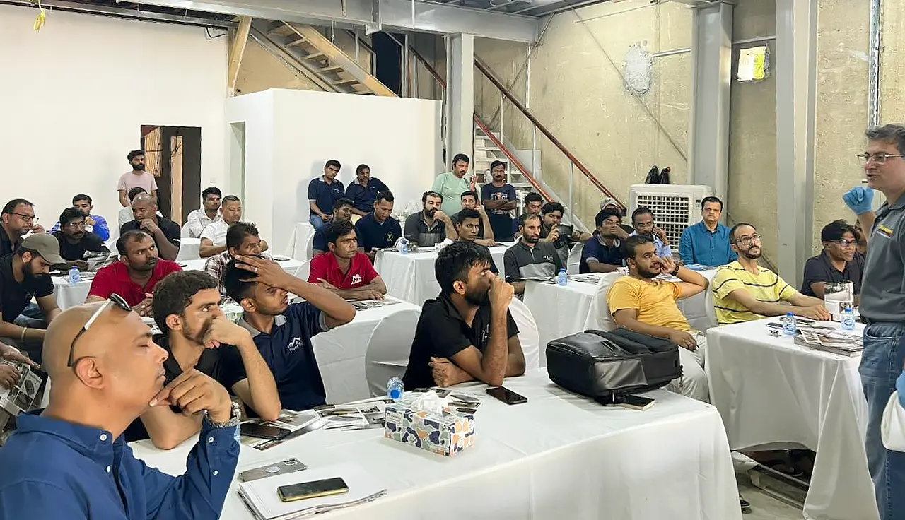 Students recieve brchure and a marketing lecture at an InstallersEdge concrete workshop in Dubai, UAE